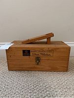 Wooden box with handle and General Electric Easy-Quick-Tidy Shoe Polisher label on front