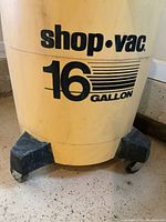 Front view of the yellow Shop-Vac body showing the 16 gallon labeling.