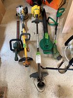 All six yard tools arranged on a floor showing overall condition and design.