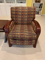 Front view of recliner chair showing wood arms and patterned upholstery