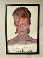 David Bowie “Aladdin Sane” framed poster in black frame