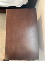 Top surface of one table showing minor scuffs and light wear