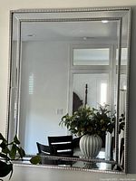 Large modern rectangular wall mirror with decorative silver frame