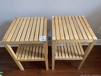 Front view of two wooden slatted shelves side by side showing top and bottom slats.