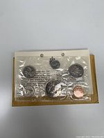 1968 Canada Royal Canadian Mint Proof Set with six coins sealed in original packaging along with display card showing information about the coins and mint.