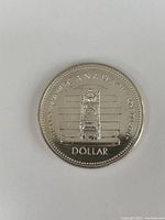 Obverse side showing Peace Tower design and inscriptions on the 1977 silver dollar coin.