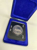Silver dollar coin from Canada Centennial 1878-1973 in blue velvet-lined presentation case.