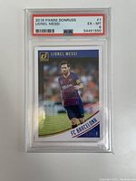 Front view of 2018 Panini Donruss Lionel Messi soccer card graded PSA 6 with Messi in FC Barcelona kit.