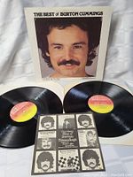 Double vinyl LP set with original cover showing front portrait and two records with CBS Direct labels, plus an insert featuring Burton Cummings photos and text.