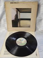 Vinyl record disc with label visible, showing condition and confirming item is vinyl LP.