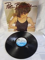 Vinyl LP record of Pat Benatar 'Crimes of Passion' with visible label from Chrysalis Records.
