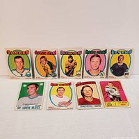 Photo showing all nine hockey cards arranged in two rows.