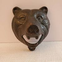 Front view showing detailed bear head with open mouth and mounting holes