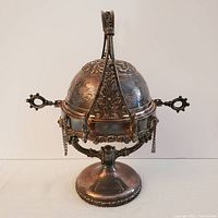 Front view of Victorian silver plated butter dish with domed retractable cover