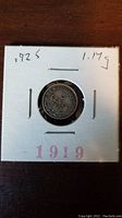 Front side of the 1919 Newfoundland 5 cent coin showing denomination and year.
