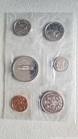 Clear image of one 6-coin set in plastic holder with visible coin designs.