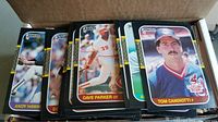 Photo showing stacks of 1980s Donruss baseball cards including players Andy Hawkins, Dave Parker, and Tom Candiotti.