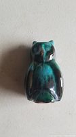 Top view image of the Blue Mountain Pottery owl figurine showing glaze colors and rounded shape.