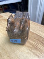 Top view showing the two bird carved lid on the wood trinket box with visible carved details on the birds.