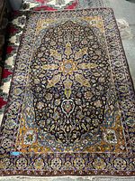 Full view of rug laid flat showing entire pattern and condition