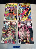 Photo showing four Marvel Hercules Prince of Power comic books issues #1, 2, 3, and 4 laid out on a surface with visible colorful comic cover art and respective issue numbers.