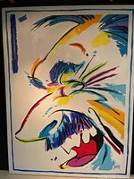 Abstract colorful oil painting on canvas with stylized face profile, bold colors, and artist signature.