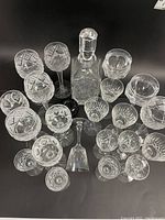 Group photo of the entire lot including decanter and array of crystal glasses.