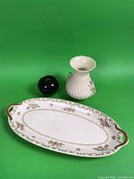 Both Belleek vase and Limoges plate shown together with a green apple for size reference