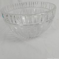 Angled side view of the clear crystal bowl showing vertical rib and geometric cut pattern