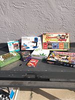 Lot of various games including Cheech & Chong-opoly and Monopoly Speed, some unopened