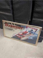 Full view of the Budweiser mirror showing the racing hydroplane graphics and branding.