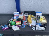 Overview of assorted office supplies laid out on table