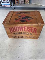 Front view of wooden Budweiser crate with large Budweiser logo and Anheuser-Busch branding.