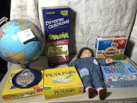 Overview of all items showing globe, boxed games, doll, and electronic game