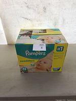 Front view of Pampers Swaddlers box showing branding, size N, and 128 count.