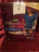 Photo of Depend Silhouette adult diaper package with 8 diapers, size L/XL G/TG maximum absorbency for women