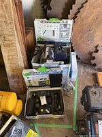 Two Festool Systainer cases open showing saw and accessories