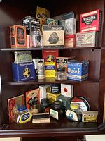 Shelves filled with assorted vintage fountain pen inks, brands, ink wells and ink bottles in original packaging.