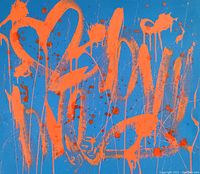 Close-up front view showing orange dripped paint strokes and splatters on blue canvas