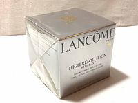 Silver box of Lancôme High Resolution Refill-3X Triple Action Anti-Wrinkle Cream showing side and top view.