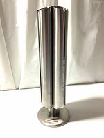 Full view of upright Swissmar Nobile capsule holder showing overall shape and finish.