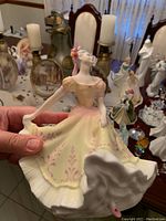 Photo of the Royal Doulton Ninette figurine showing detailed dress and pose