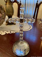 Clear faceted crystal cross on matching crystal dome base