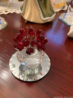 Front-angle view of crystal bouquet set on mirror base
