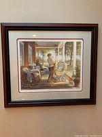 Front view of framed print showing mother and baby carriage on a porch scene