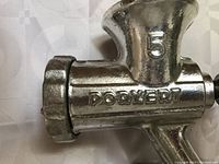 Close-up of Porkert #5 clamp-style meat grinder body showing embossed brand name and size number