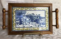 Rectangular wooden tray with hand-painted blue and white tile illustrating historical scene from Portugal, framed in wood with handles.