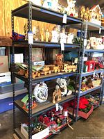 Full front view of the metal shelving rack loaded with various decorative items and storage boxes on shelves to show scale and materials.