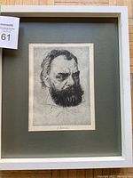 Framed etching portrait of a bearded man with pencil signature visible under the image, showing overall condition and presentation.
