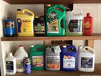 Photo showing an assortment of motor oils and automotive chemicals arranged on a shelf